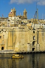 Ferry passing the fortifications of Senglea