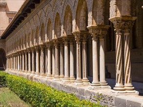 Cloister with ornate pillars at Monreale Cathedral or Cathedral Santa Maria Nuova