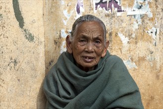 Old Nepalese woman with green cape
