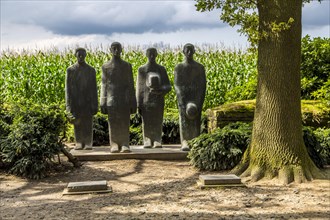 Langemark German war cemetery with monument ""Grieving Soldiers"" by Emil Krieger