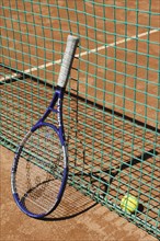 Tennis racket next to net
