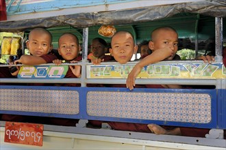 Buddhist child monks taking the school bus