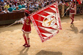 Man carrying a flag from the Giraffe contrade