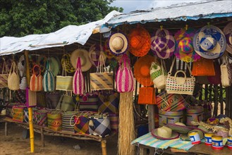 Hats and baskets in a market stall
