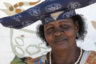 Local Herero woman wearing typical headdress and dress