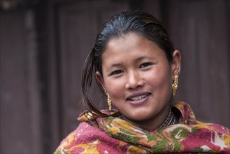 Young Nepali woman with earrings