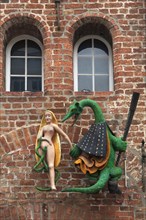 Figures of a dragon and a woman on the facade of the former Hieronymus Restaurant & Cafe