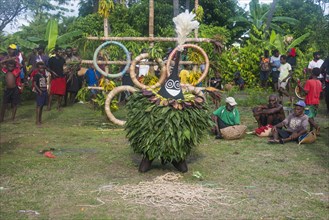 Traditional masked man at a Taboo death ceremony