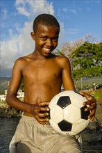 Smiling young with football