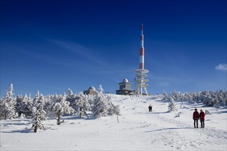 Radio transmission tower and snow-covered trees on Mt Brocken