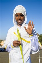 Orthodox girl praying at the Easter ceremony