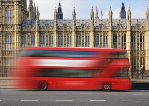London Bus going past the Houses of Parliament