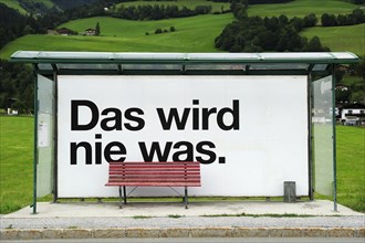 Bus stop that says ""Das wird nie was"" or ""that'll never work""