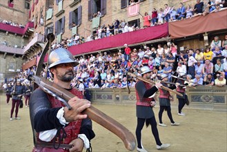 Cross-bow bearer at the parade before the historical horse race Palio di Siena