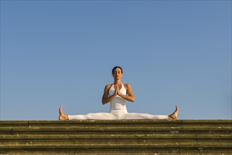 Young woman practising Hatha yoga
