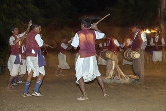 Nepalese men perform a traditional dance