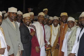 Friendly Comoran men at a traditional wedding of a rich man