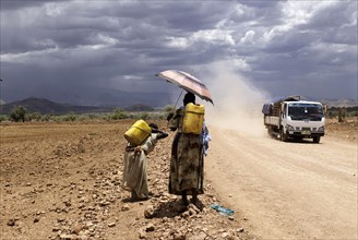 Female water carriers on the road between Adrigat and Mekele