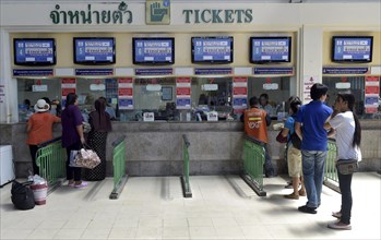 Travellers at a counter of railway station