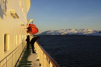 People on the deck of the Hurtigruten ship MS Nordlys