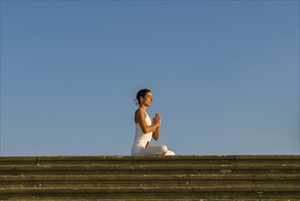 Young woman practising Hatha yoga