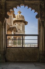 Looking out a window at the city palace of the Maharaja
