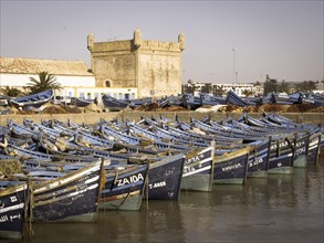 Old blue fishing boats in the port of Essaouira