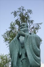 Close-up of the statue of the sage Confucius in the Chinese Garden