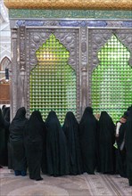 Women praying in front of the tomb of Ayatollah Khomeini in the Holy Shrine