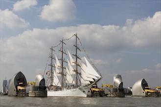 The Polish sail training ship Dar Mlodziezy passes through the flood protection barrier of the River Thames