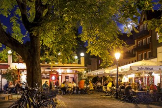 Outdoor cafes in the historic centre in the evening