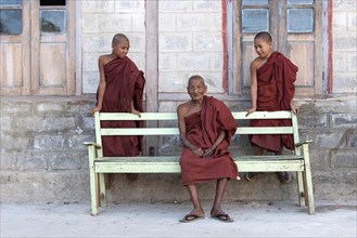 Monk with two novice monks at the Shwe Yaunghwe Kyaung Monastery
