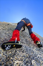 Climber climbing on a rock wall