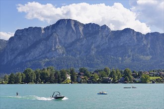 Electric boats on Mondsee Lake with Mt Drachenwand