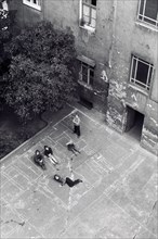 Children playing in the backyard of the house Stargarder Strasse 21