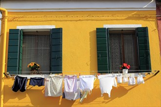 Clothesline on a yellow facade