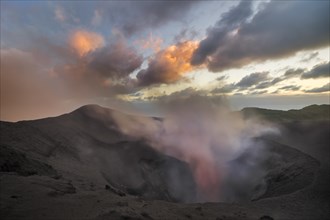 Steam rises from the open crater of the volcano Mount Yasur