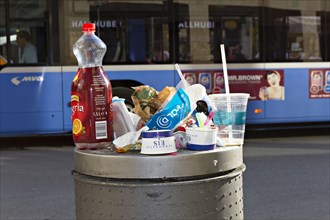 Full street rubbish bin