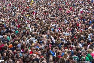 Densely packed crowd at a public festival