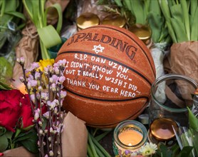 Flowers and a basektball to commemorate the man killed at Copenhagen's main synagogue during a terrorist attack on 15 February 2015