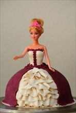 A princess cake moulded on to a Barbie doll