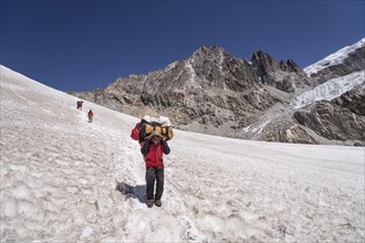 Carrier descending from the Cho La pass over snow field