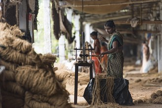 Manufacture of ropes from coconut fibers or coir on wooden machines