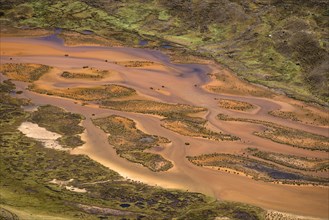 Small meandering river carries large quantities of sediments