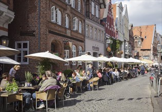Am Stintmarkt with people sitting outside restaurants