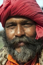 Nepalese man wearing a red turban