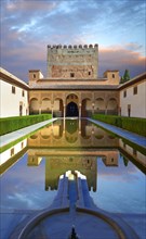 Arabesque Moorish architecture and pond of the Court of the Myrtles of the Palacios Nazaries
