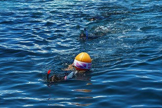Snorkeler with diving buoy