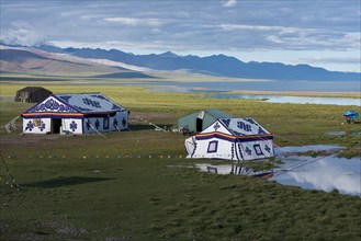 Modern colourful Tibetan picnic tents on the banks of the holy Namtso or Lake Nam