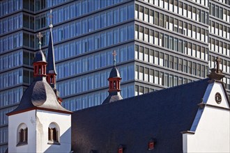 Alt St. Heribert Church in front of Lanxess AG Headquarters